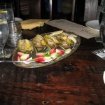 Grilled artichokes and vegetable medley with marinated radishes and maltaise sauce